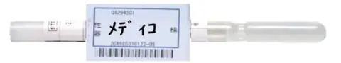 Storage container with blue-framed barcode label